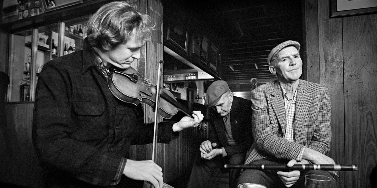 Gussie Russell listening to fiddle player